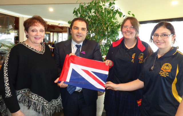 Tony-Pasin-presents-Australian-Flag-to-Rachel-Anderson-and-Kalimna-Roe-Simons